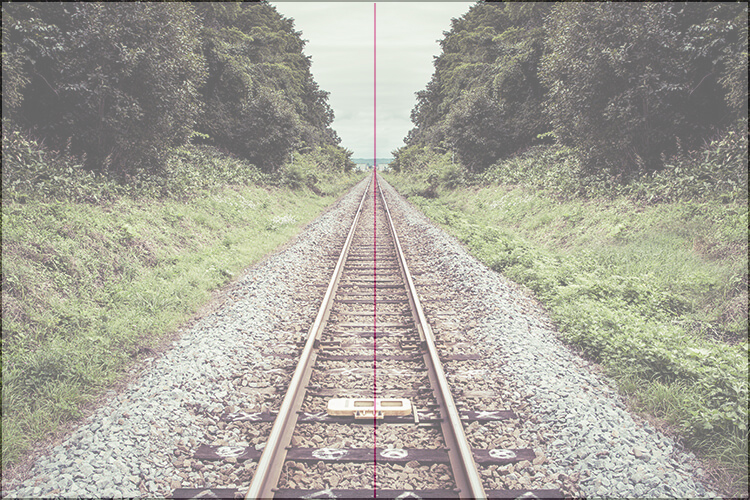 Photograph of the railroad track in a two-part composition