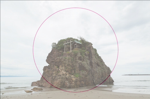 A photo of a rock in the sea in the Hinomaru composition