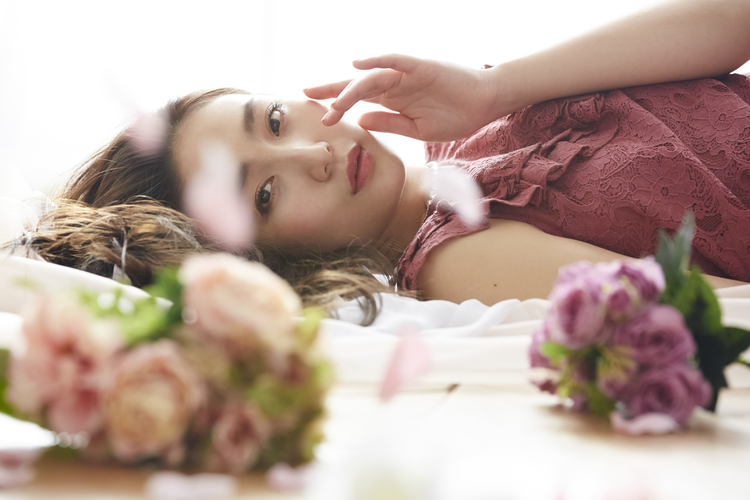 Woman lying in a flower