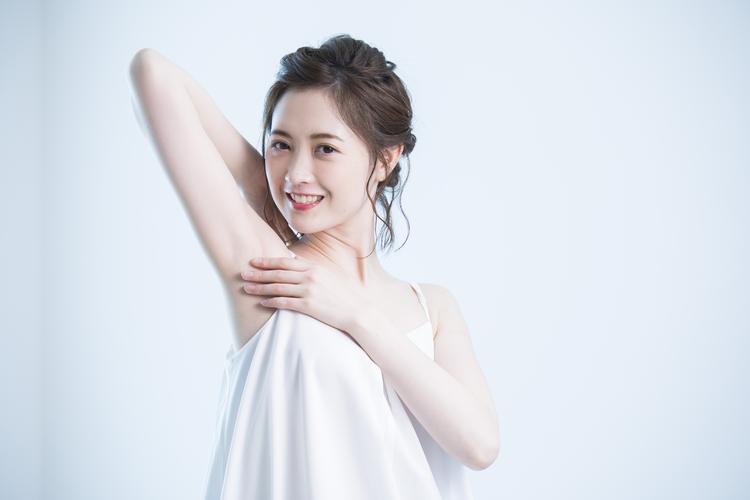 Woman holding aside with a smile